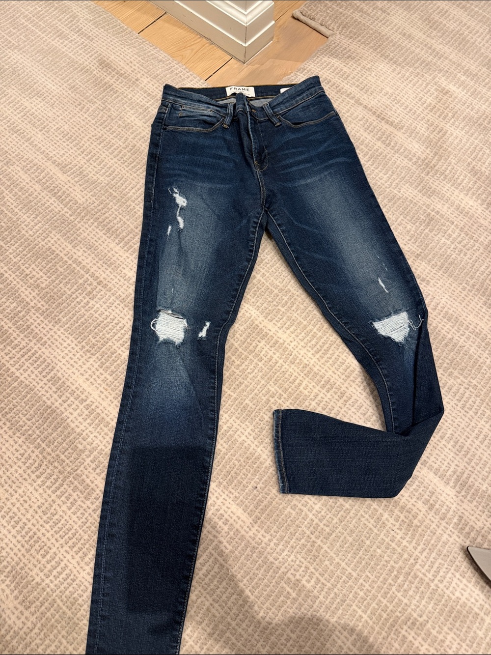 Frame Denim High-Rise Skinny Jeans in Dark Blue with Knee Distressing